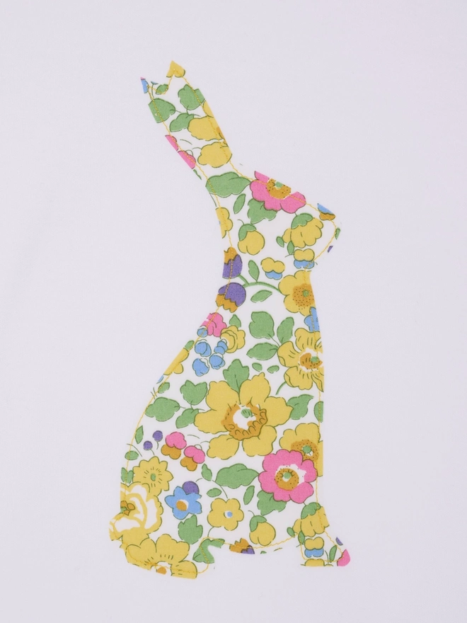  a cotton baby bodysuit babygrow with an easter bunny cut from yellow floral liberty print 