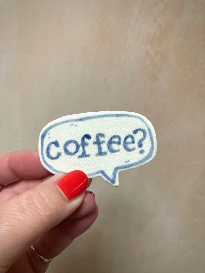 porcelain badge with hand painted word coffee