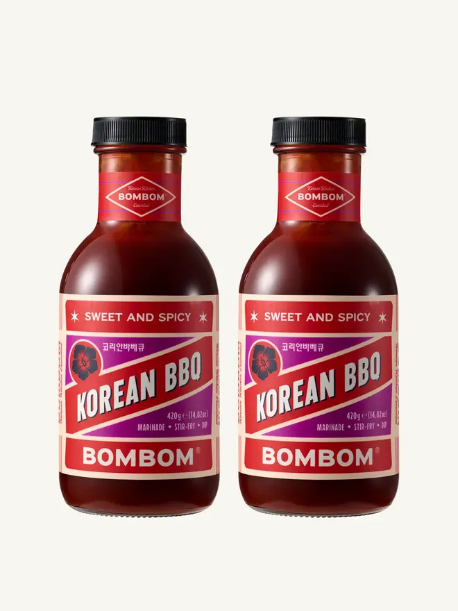 sweet and spicy korean bbq sauce. two bottles of korean bbq sauce with red and purple labels.