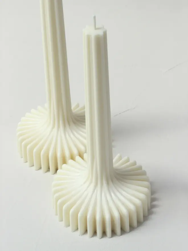 geometric aromatherapy soy candles (pack of 2). candles photographed from above to show geometric detaials.