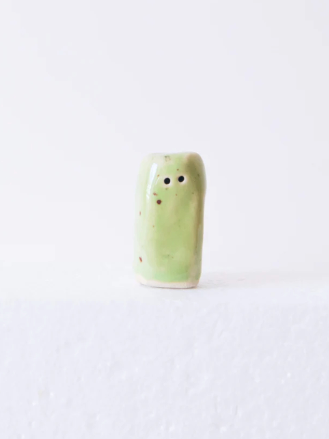 Wee Guys. A wee guy in green.