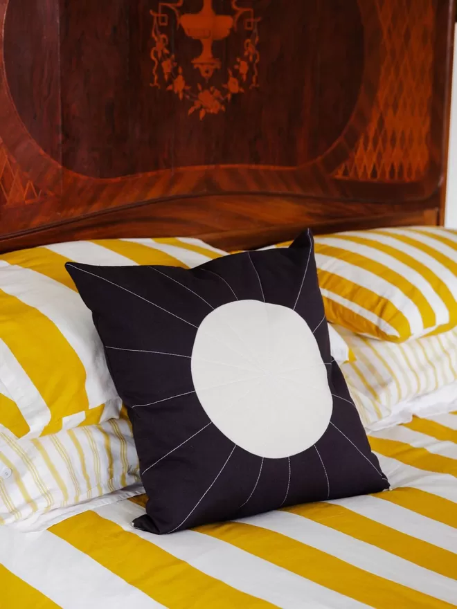 Moonglow Quilt Cushion On Bed In Bedroom