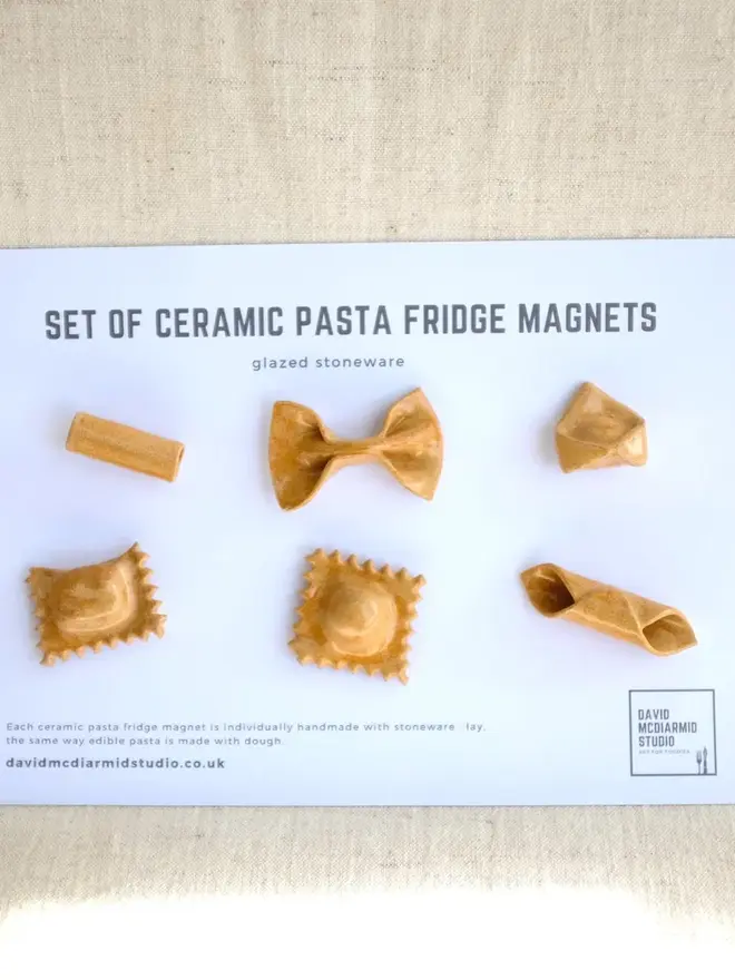 ceramic pasta magnets (set of 6). a set of 6 pasta magnets in plain glaze on a paper back.
