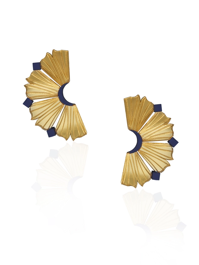 A pair of earrings that resembles like coral wall of Kenyan Island, Lamu. The earrings are in gold colour with 3 navy small cubes dotted on the edge and on the inside part of the earrings in crescent shape. The gold acrylics have texture which resembles similar to sliced pineapples..
