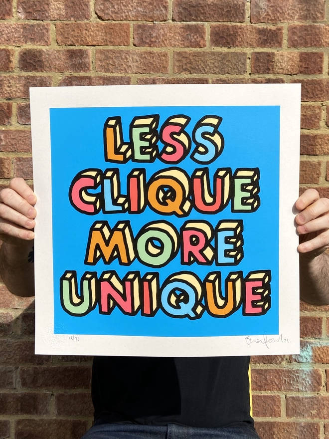  "Less Clique More Unique" Hand Pulled Screen Print blue background with multi colour letters with black hand drawn outline that spell out less clique more unique