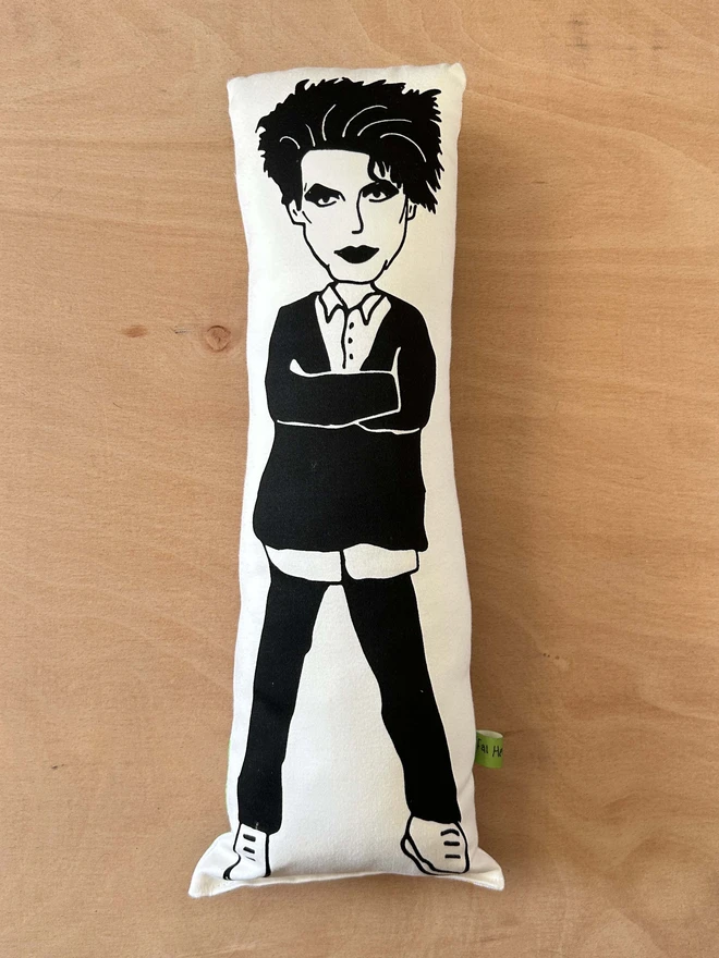 Illustrated cushion featuring Robert Smith