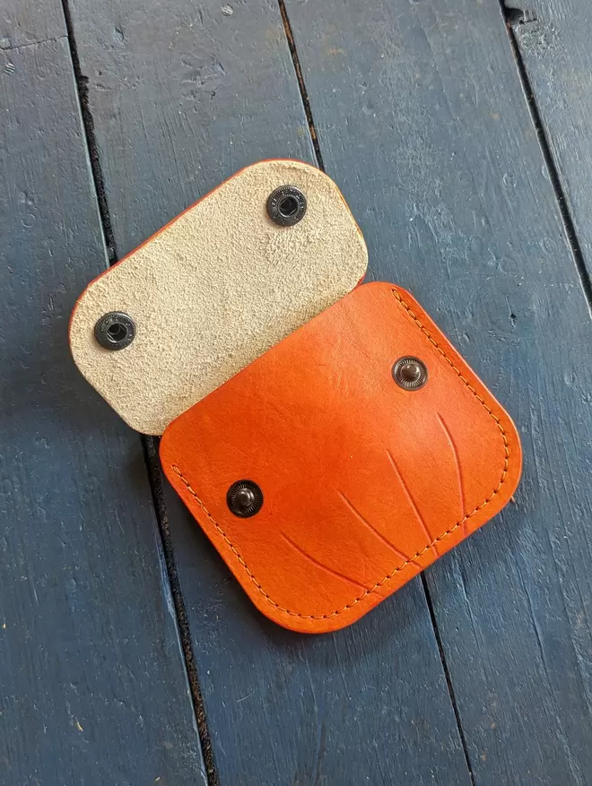 Open front view of handmade leather Jack O' Lantern pumpkin purse.