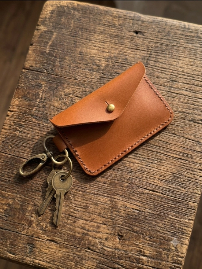Tan leather card holder with metal clip
