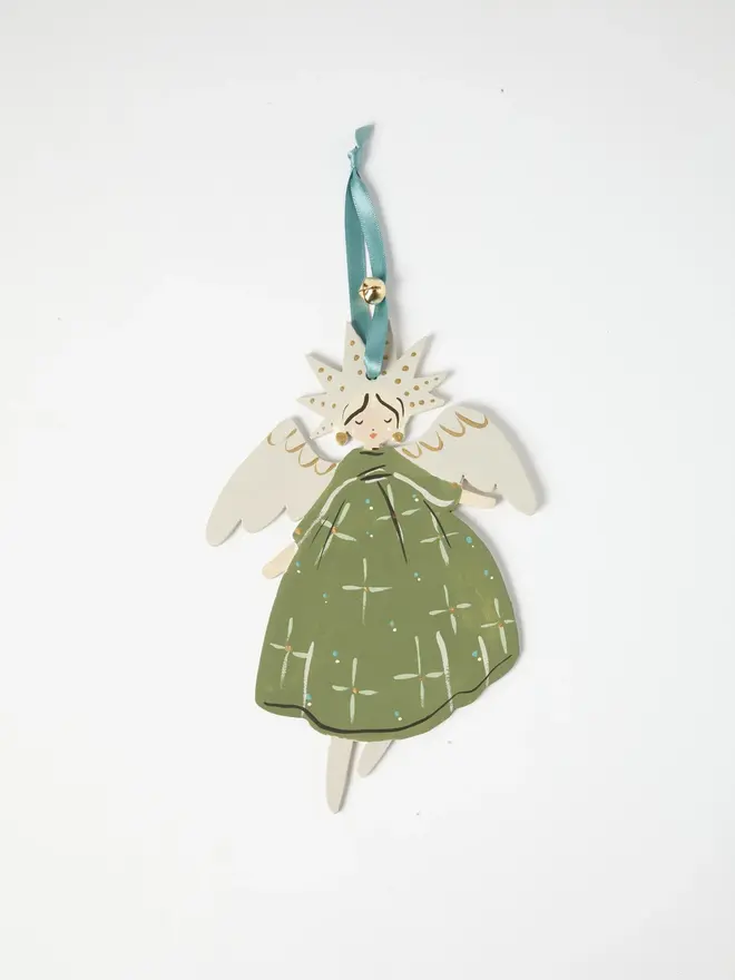 Angel Tree Dancer. wooden hanging angel decoration with a star-shaped gold-flecked halo, cream wings and sage green star-patterned gown, duck egg blue ribbon with a jingle bell, on a white background