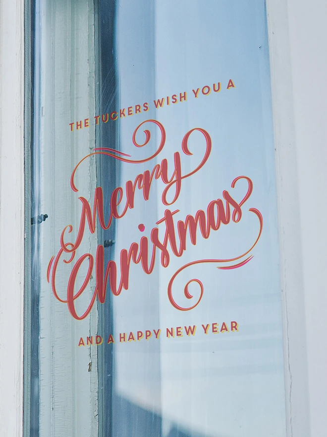 personalised wishing you a merry christmas on a window
