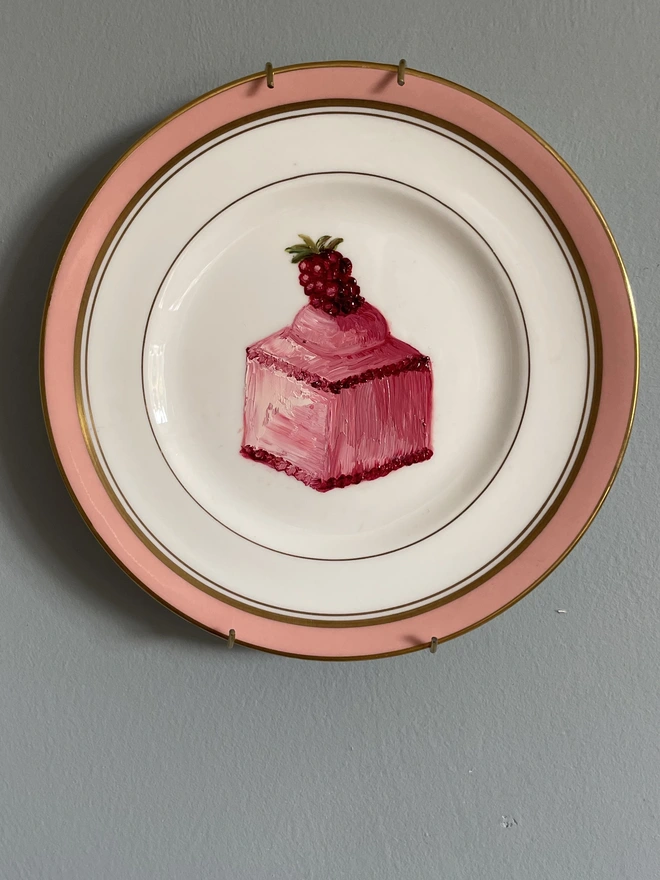 raspberry fondant cake painting on old plate