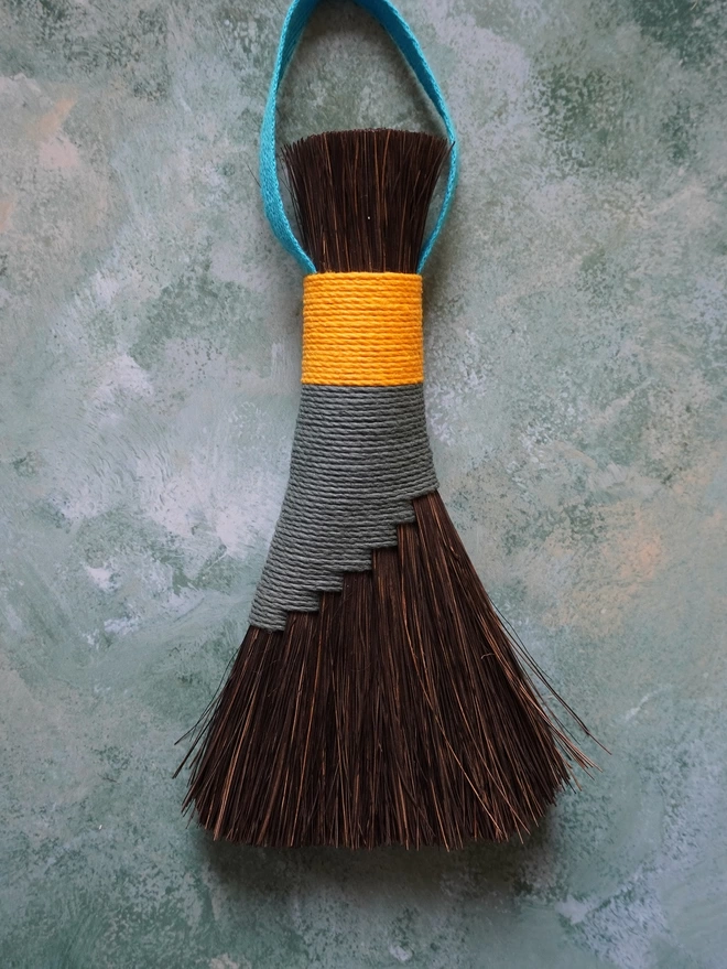 Arenga brush with teal and gold hemp cord binding
