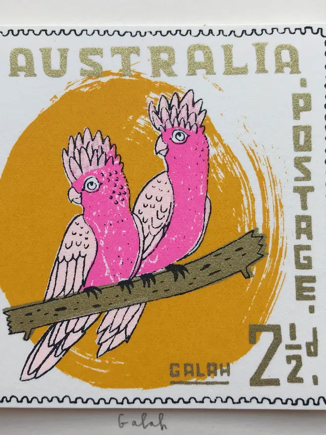 Bird Stamp Card Australian Galah, a white card with a colourful bird design above a white surface. 