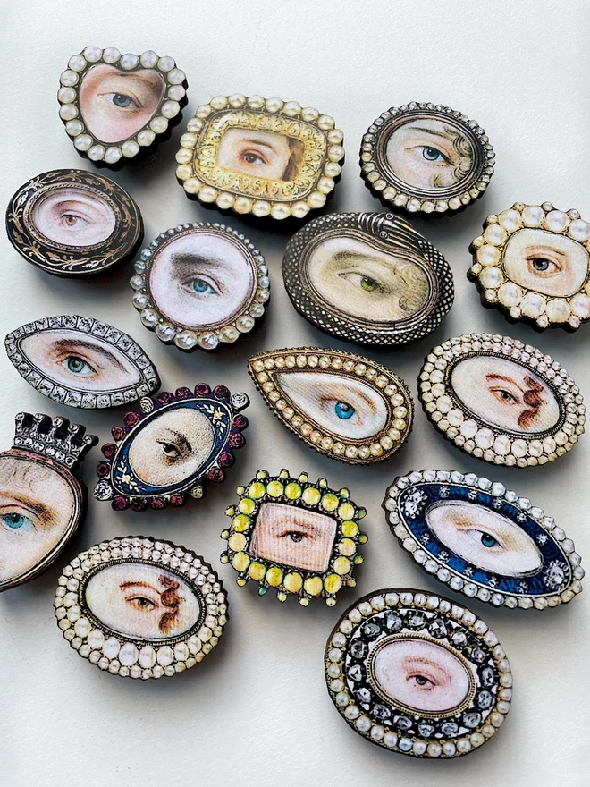 collection of lovers eye brooches 