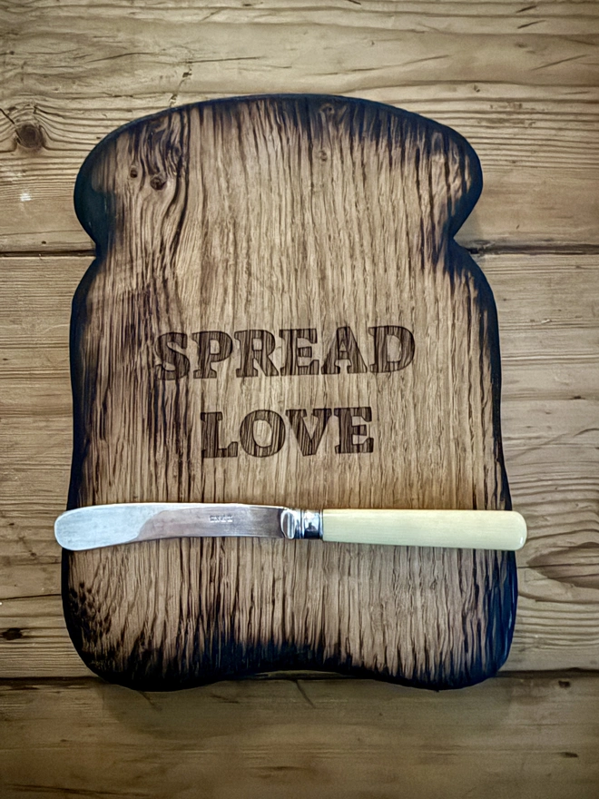 Engraved WithLove toast shaped serving board and vintage cream handled butter knife