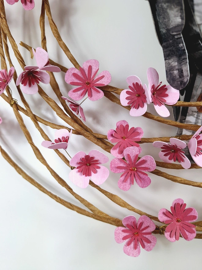 close up of handmade paper flowers in pink