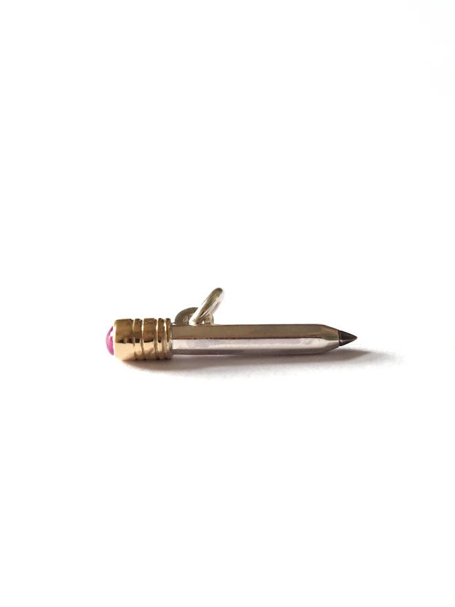 Ruby dinky pencil charm on a white background