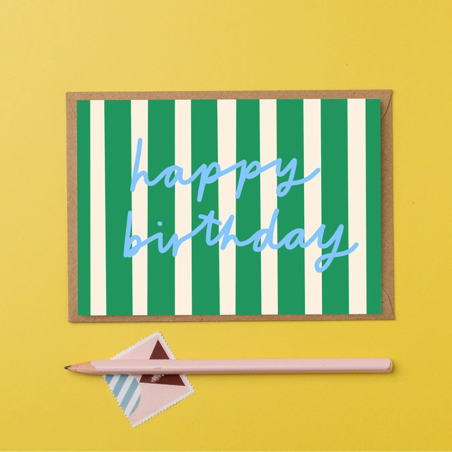Happy birthday card featuring green stripes and the words happy birthday in blue hand written font.