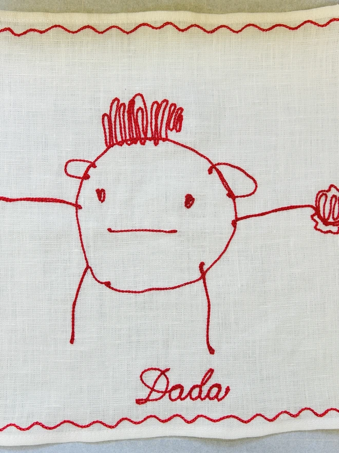child's drawing embroidered onto linen white handkerchief red thread
