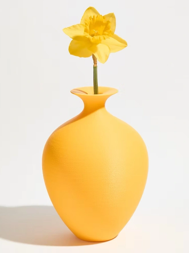 urn shaped yellow 3d printed vase with yellow flower