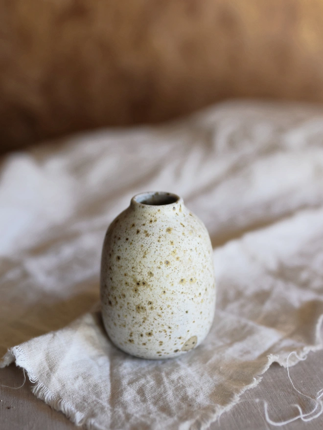 Stoneware bud vase. A small stoneware handmade bud vase with a speckled glaze