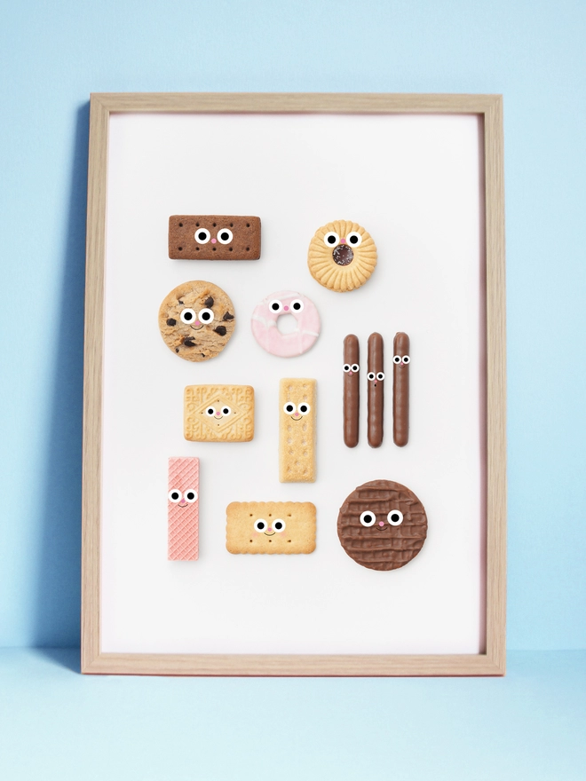 An A3 print of a selection of cute biscuits with faces. on a white background 