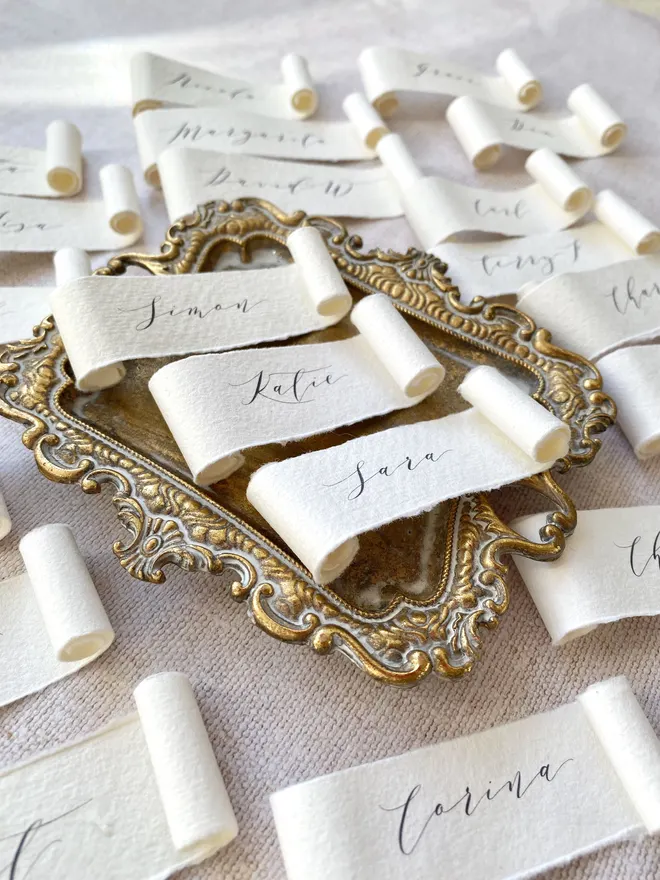 Handmade paper scroll place cards