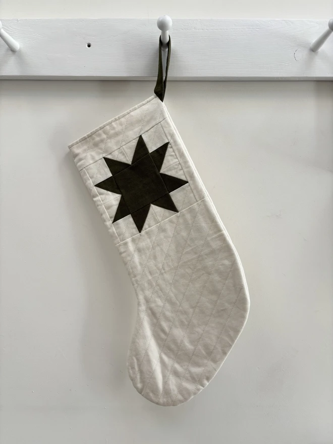 Medium star quilted linen Christmas Stocking. Ivory linen stocking with green linen patchwork star detail. 