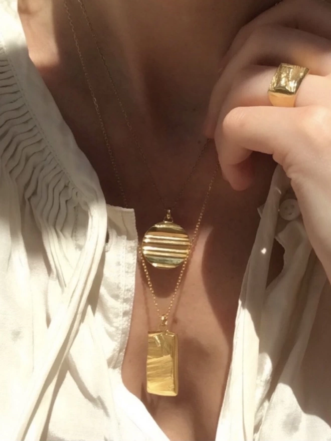 layered atlas and nepenthe pendants, handcrafted from 18 carat gold plated silver, made in the UK