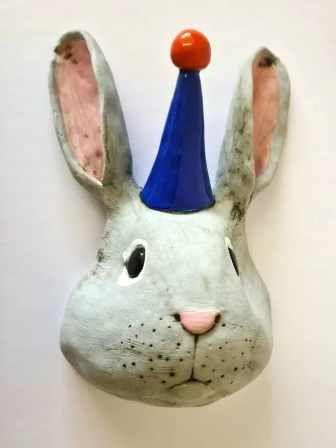 Bobby the rabbit trophy style head seen on a white wall.