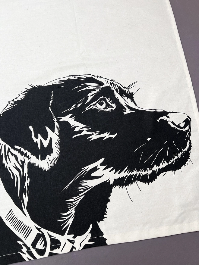 Bottom half of the tea towel showing the Labradors face