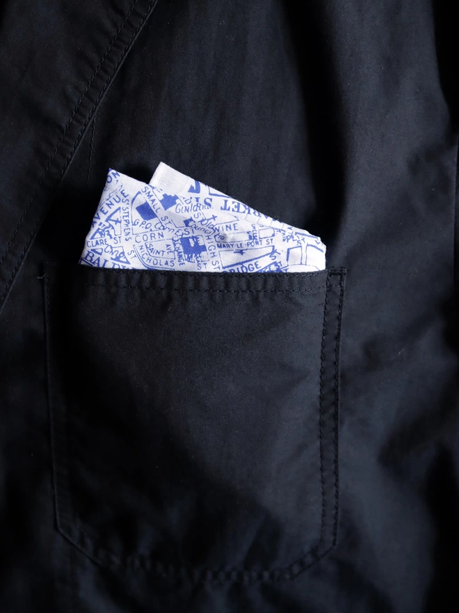 A Mr.PS Bristol map hankie tucked in the top pocket of a dark blue jacket